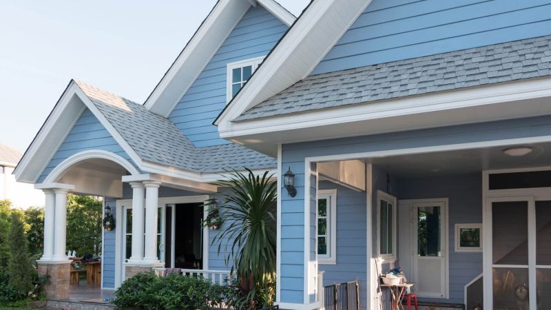 exterior of a nice blue single family home