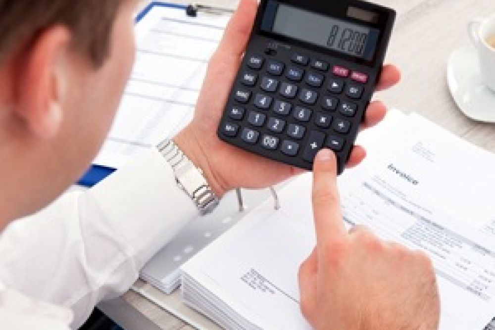 Man holding calculator