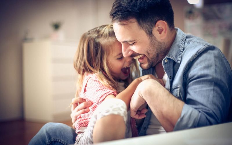 father with daughter playing