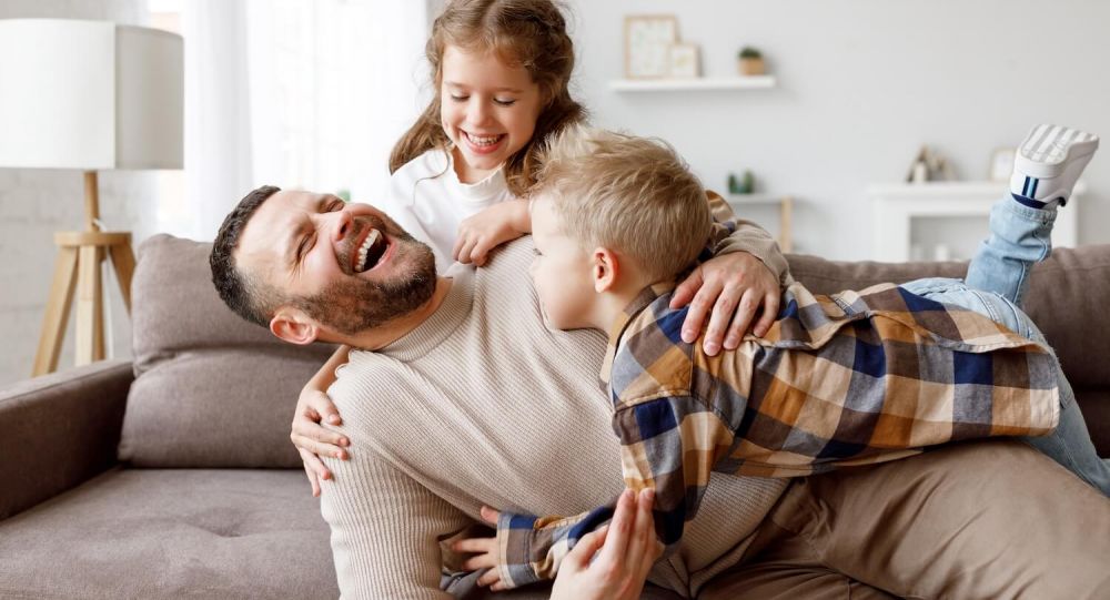 father with kids on couch