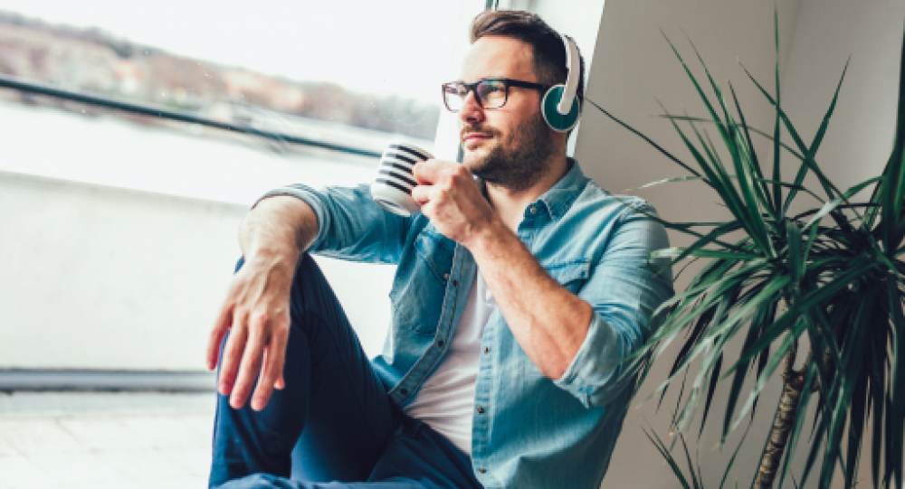 man listening to podcast
