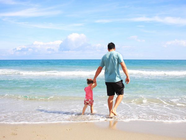 father and daughter at beach
