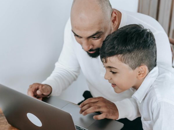 Father and son on computer