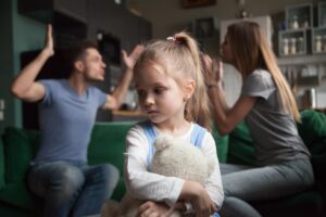 couple fighting with child in the room