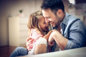 father with daughter playing