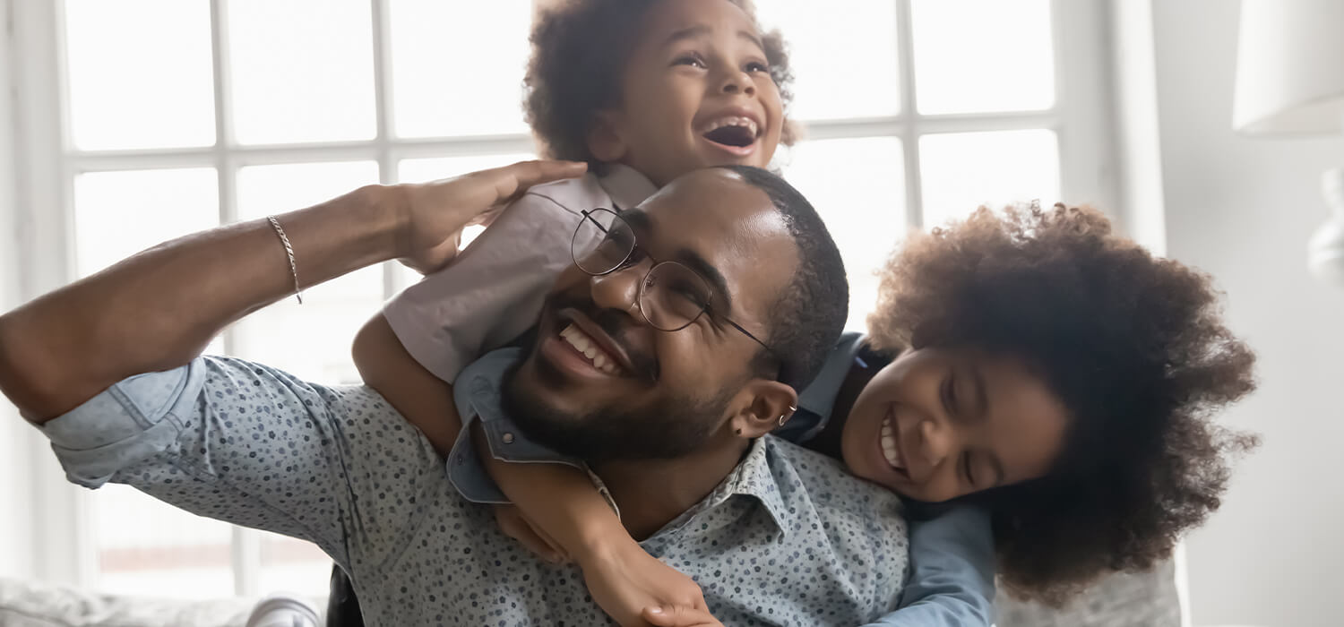 happy single dad playing with his kids